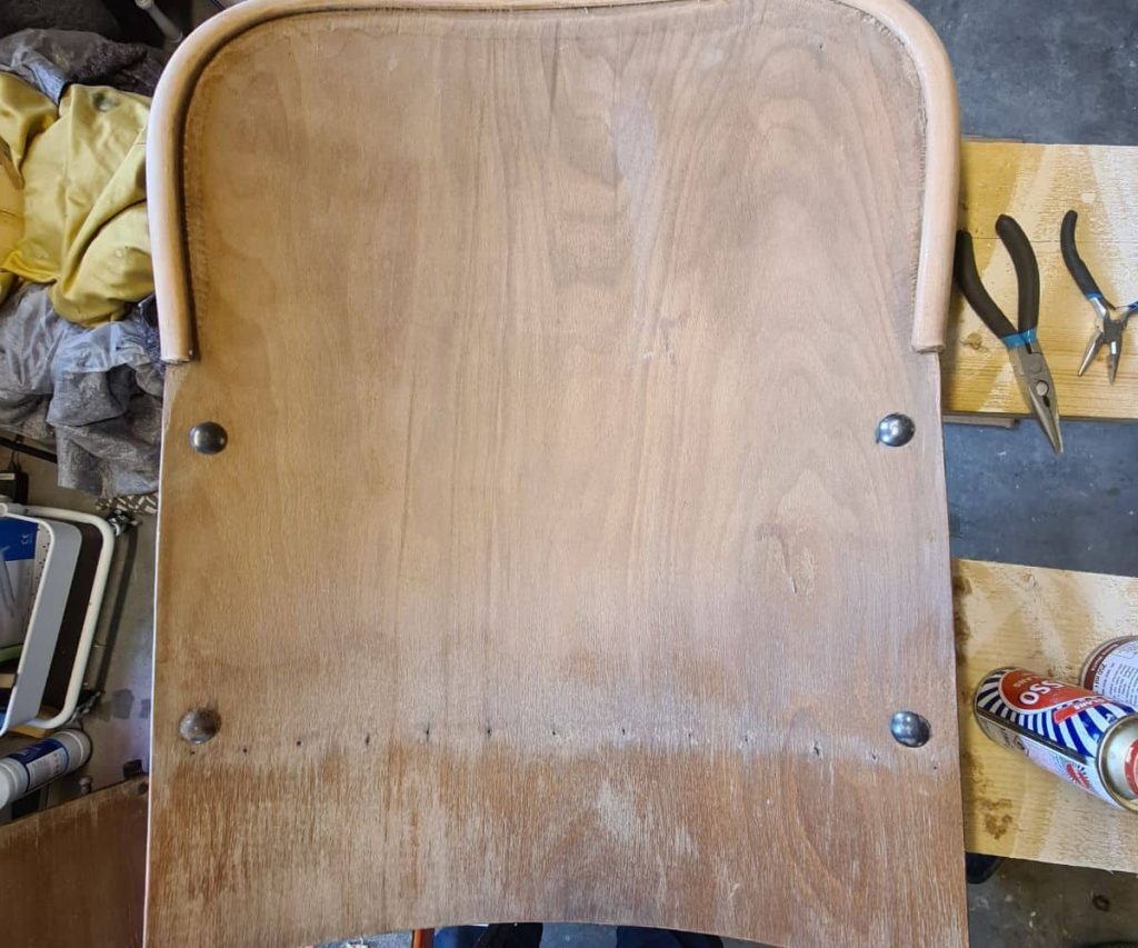 Finish removed by vintage theatre chairs are stained